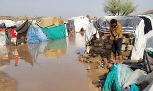 A site for people in Sa'ada city, Yemen, who have fled their homes is flooded by torrential rain.