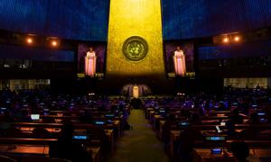 A wide view of the General Assembly Hall as Amanda Gorman (on screens and at podium), poet and activist from the United States, addresses the SDG Moment.