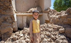  9-year-old Farzan in the ruins of his house in Ghor province, western Afghanistan (May 2024)