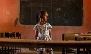 6-year-old Fatima, from Khartoum stands in an empty classroom at the UNICEF supported safe learning space in Kassala state, Sudan
