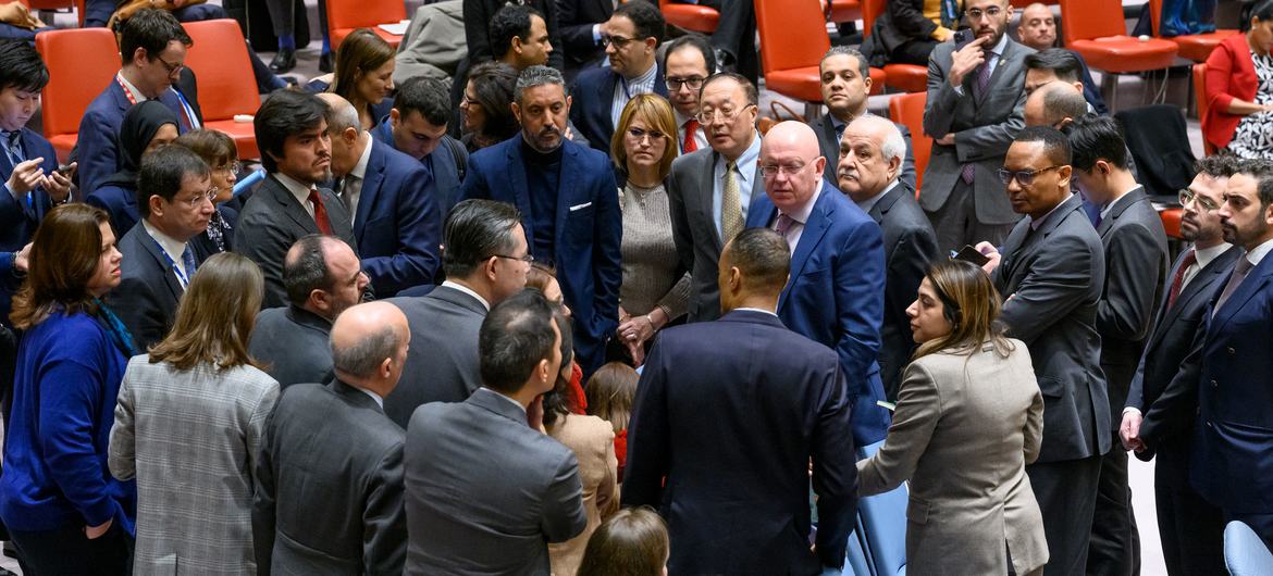 Security Council members and delegates huddle for a discussion after emerging from closed consultations following a meeting on the situation in the Middle East in December 2023. (file)