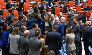 Security Council members and delegates huddle for a discussion after emerging from closed consultations following a meeting on the situation in the Middle East in December 2023. (file)