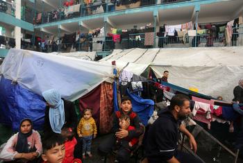 Displaced Palestinian families seeking refuge at an UNRWA school-turned-shelter in Gaza in December. (file)