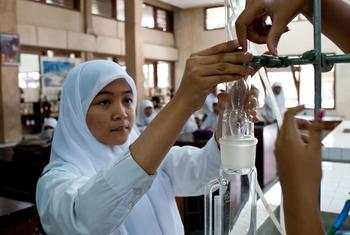 A student works in a chemistry lab in Indonesia's Yogyakarta Province.