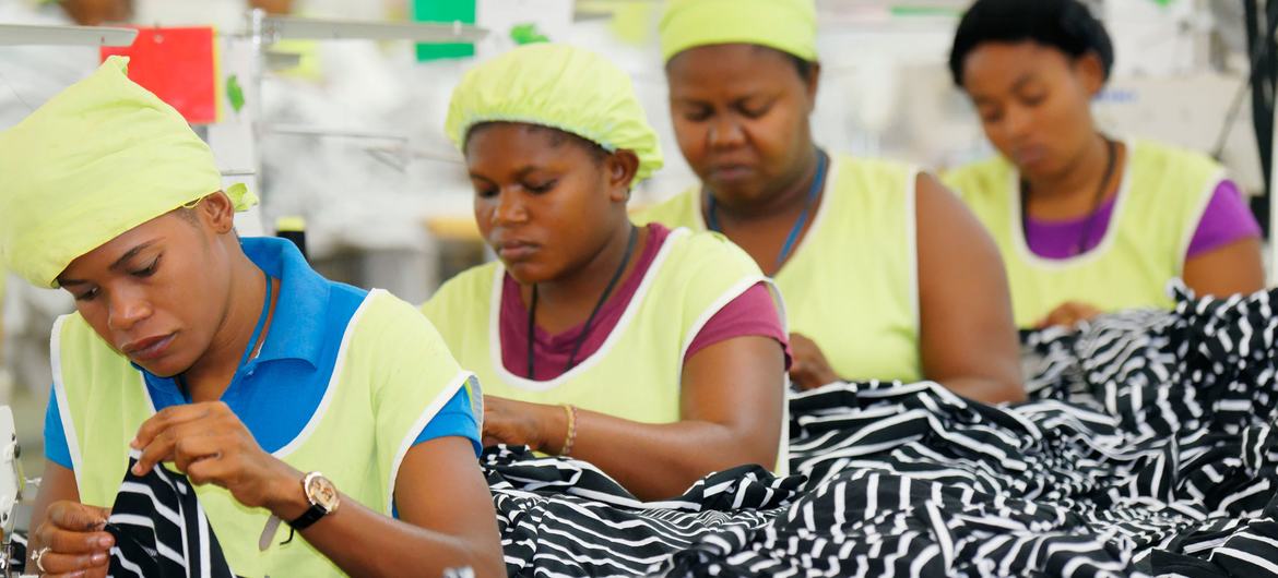 Haitian tailors work on a production line in a clothing plant.