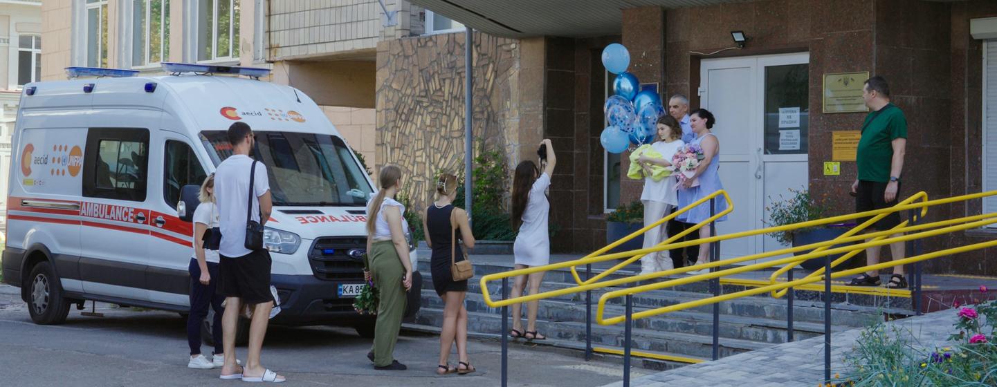 A family celebrates a birth outside the Kyiv Regional Perinatal Centre.