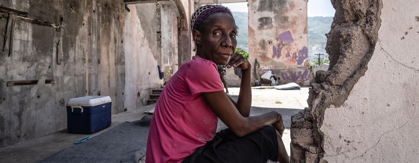 A displaced Haitian woman sits on the roof at the Rex Medina theater in downtown Port-au-Prince.