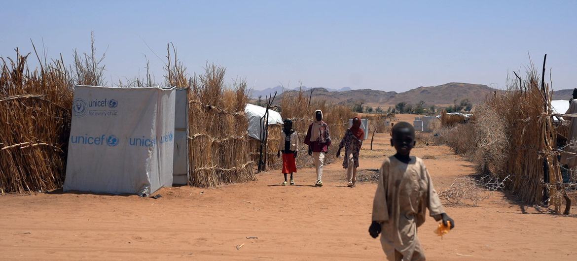 Displaced from El Fasher, an 11-year-old child makes their way through a settlement for displaced persons in Tawila, North Darfur.