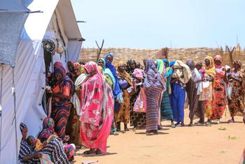 Women who fled the fighting in El Fasher wait for services at a UNFPA clinic in Tawila, Sudan.
