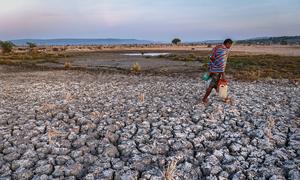 A man crosses parched farmland in East Nusa Tenggara Province, Indonesia. (file)