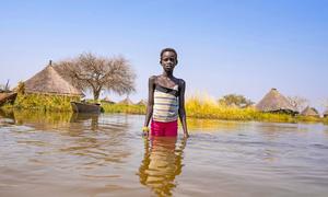 A child navigates flood waters in Jonglei State in South Sudan.