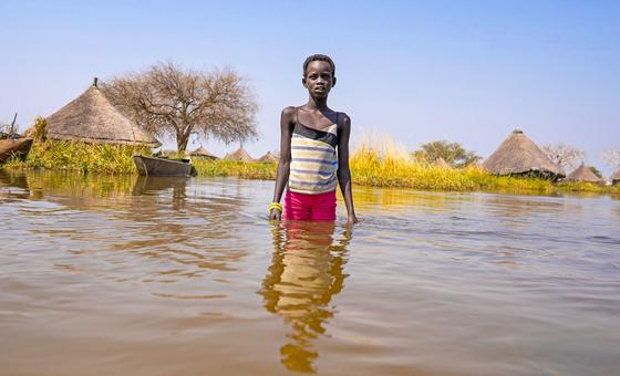 A child navigates flood waters in Jonglei State in South Sudan.