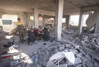 A family gathers in a damaged building in Rafah in the southern Gaza Strip.