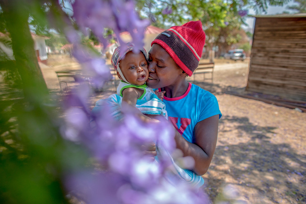 A 35-year-old HIV-positive mother holds her six-month-old baby.