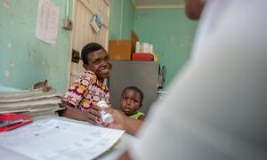 A woman living with HIV receives medication at a hospital in Zimbabwe.