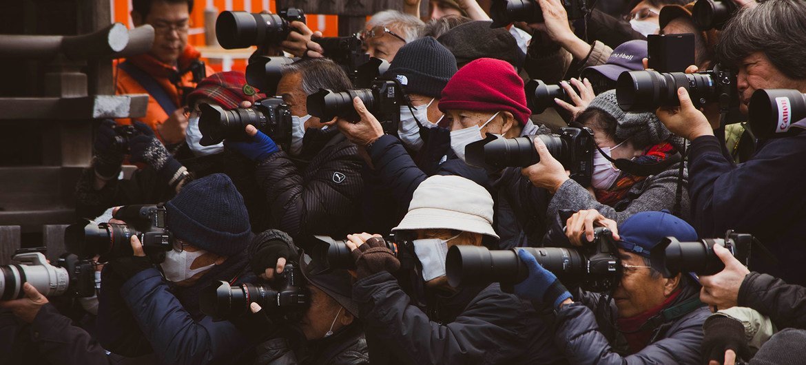 Press gather at an event in Shanghai, China.