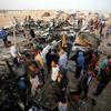 Gazans gather at a camp for displaced people which was bombed in May 2024. (file) 