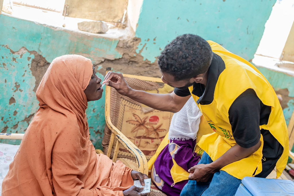 A woman receives a cholera vaccination in Sudan.