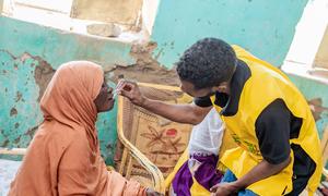 A woman receives a cholera vaccination in Sudan.