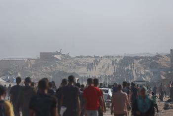 Crowds move towards an aid delivery point in the northern Gaza Strip.
