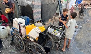 Children collect water in the Gaza Strip.