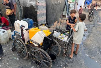 Children collect water in the Gaza Strip.