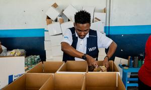 Food is packed for distribution to people affected by Hurricane Melissa in Jamaica.