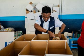 Food is packed for distribution to people affected by Hurricane Melissa in Jamaica.