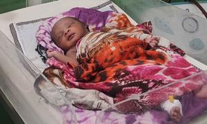 A newborn in the Saudi Maternity Hospital, El Fasher in Sudan. 