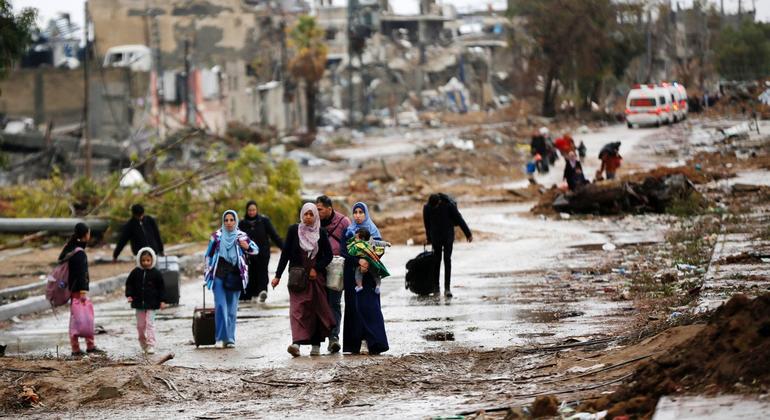 Displaced people walk from the north of Gaza towards the south, as ambulances head in the other direction. (file)
