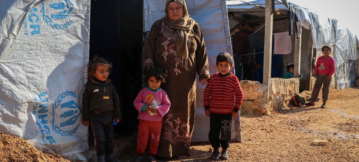 A displaced family living in a makeshift tent in a camp in northern rural Aleppo, Syria.