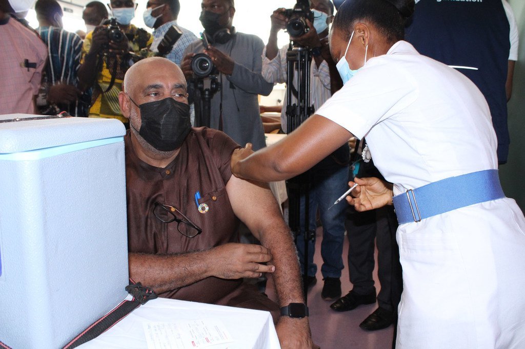The UN Resident Coordinator in Ghana, Charles Abani, receives a COVID-19 vaccination (file)