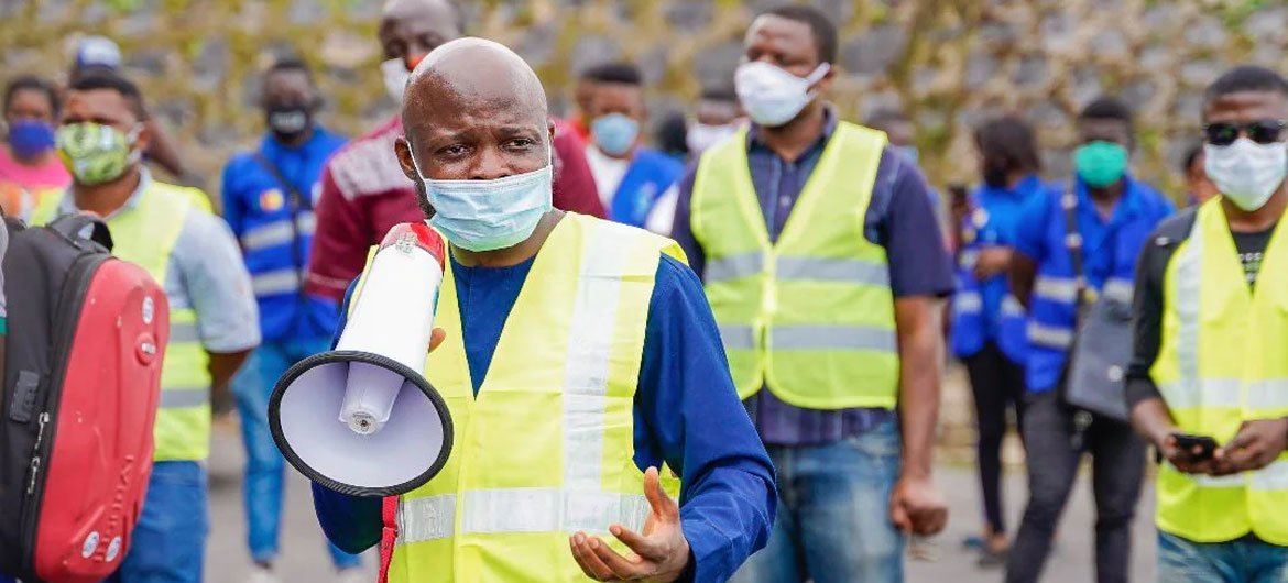 Christian Achaleke addresses a community in the conflict-affected southwestern Cameroon asking them to unite to fight their common enemy, COVID-19.