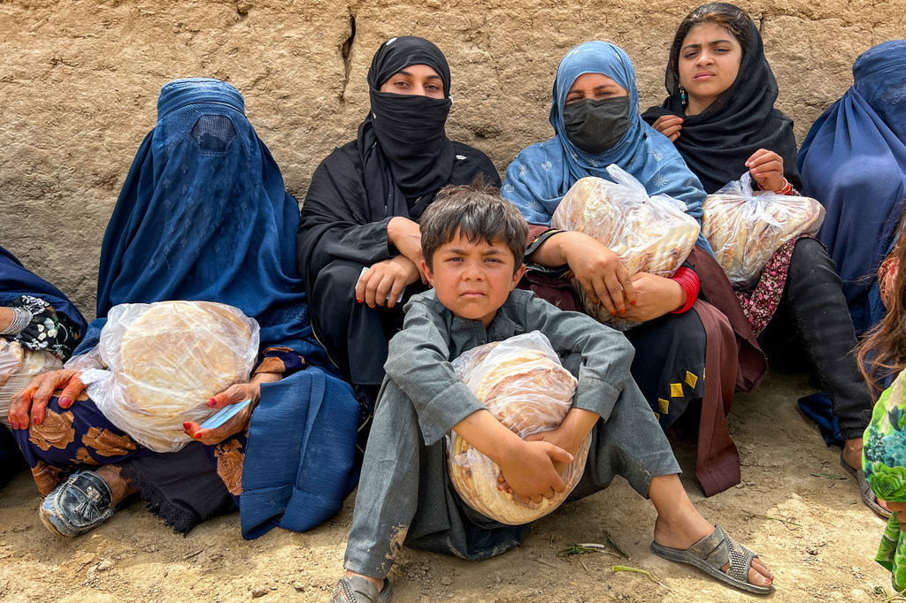 Women and children hold bread in Baghlan, northern Afghanistan.