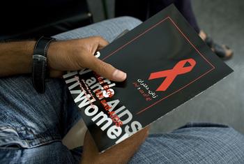 A man holds a brochure about HIV/AIDS as he waits to attend a meeting on the disease in Iran. (file)