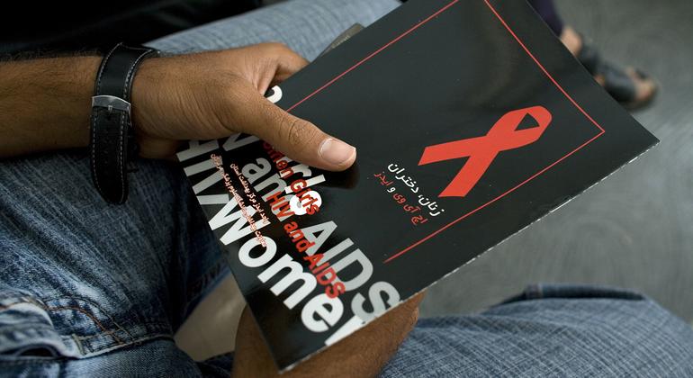 A man holds a brochure about HIV/AIDS as he waits to attend a meeting on the disease in Iran. (file)
