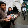 Food is distributed at a shelter in Deir Al-Balah, Gaza.