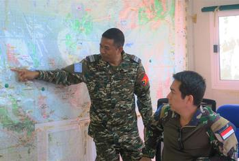 A peacekeeper from Timor-Leste (left) works alongside an Indonesian colleague at the UN peacekeeping mission in South Sudan.