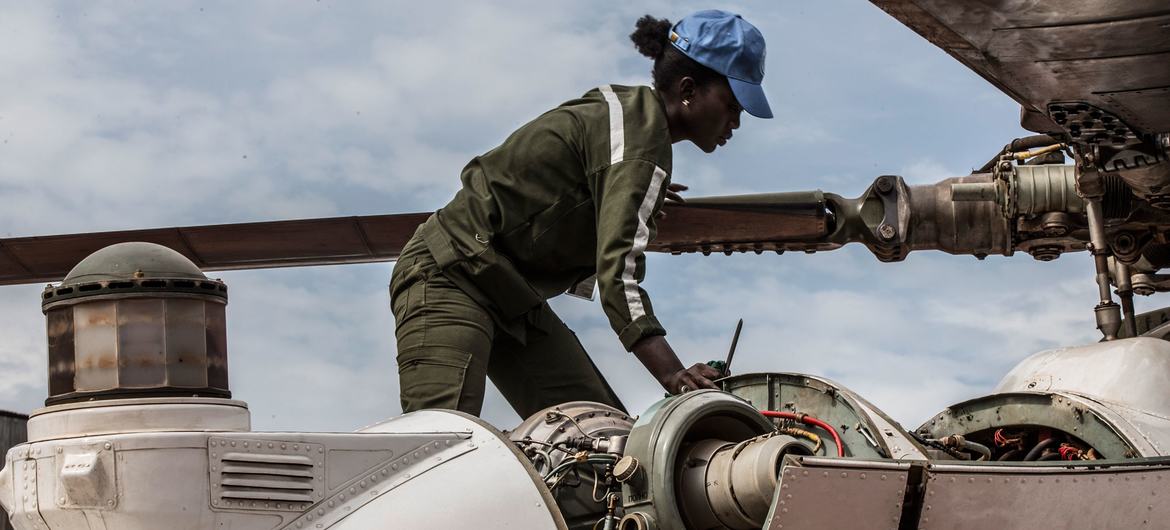 A Senegalese woman peacekeeper works on a helicopter deployed to MINUSCA, the UN peacekeeping mission in the Central African Republic.
