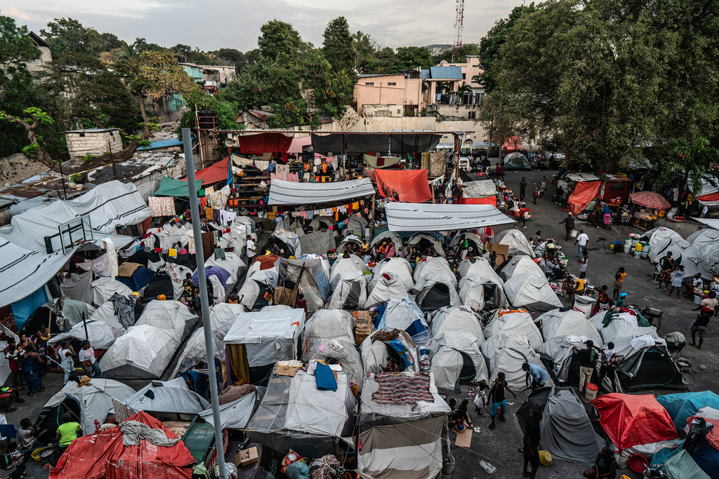 Over 600 families who fled their homes because of violence are now living in tents in a former school.
