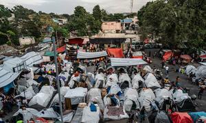 Over 600 families who fled their homes because of violence are now living in tents in a former school. 