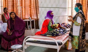 A nurse interacts with a mother at a pre-natal care ward of Combined District Hospital in Chitrakoot, India.