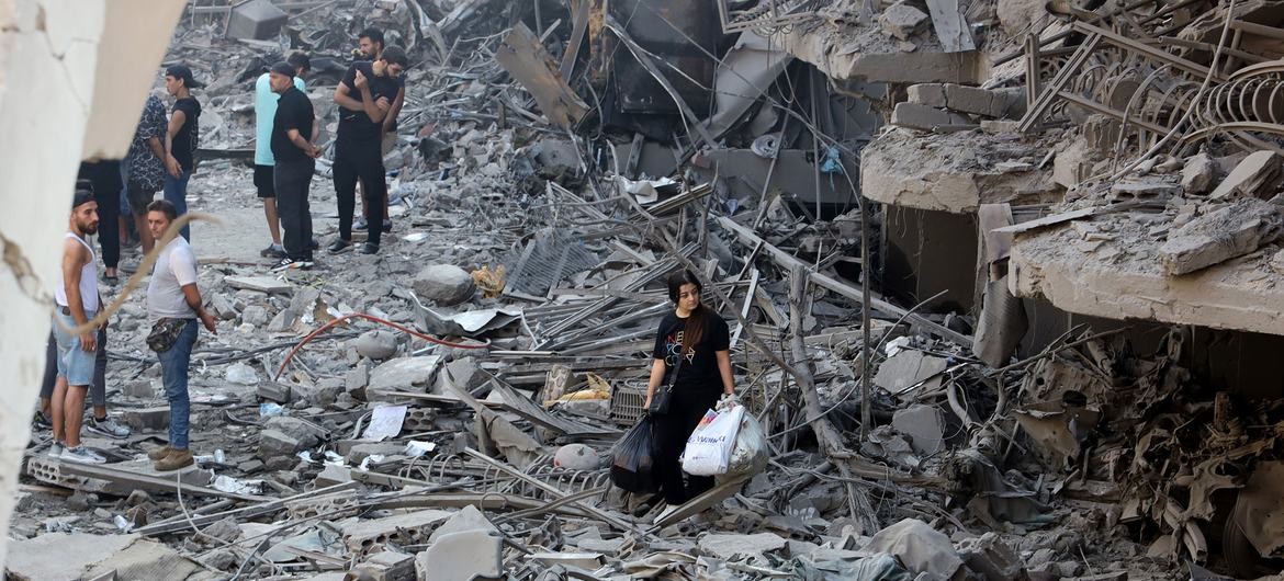 Residents survey the damage in a suburb of southern Beirut left in ruins after being targeted by airstrikes.