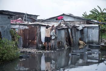 A man in Les Cayes in Haiti repairs his home which was damaged by Hurricane Melissa.