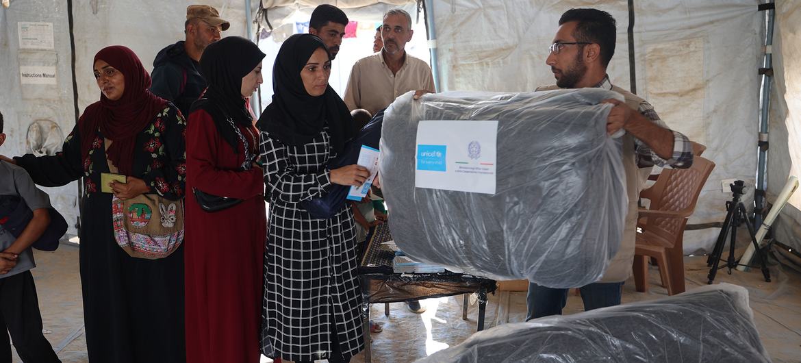 Gazans receive blankets from the UN as winter approaches in the enclave.