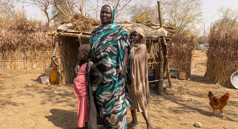 Sudanese refugees stand outside their home at the Kurmuk transit centre in the Benishangul-Gumuz region of northwestern Ethiopia.