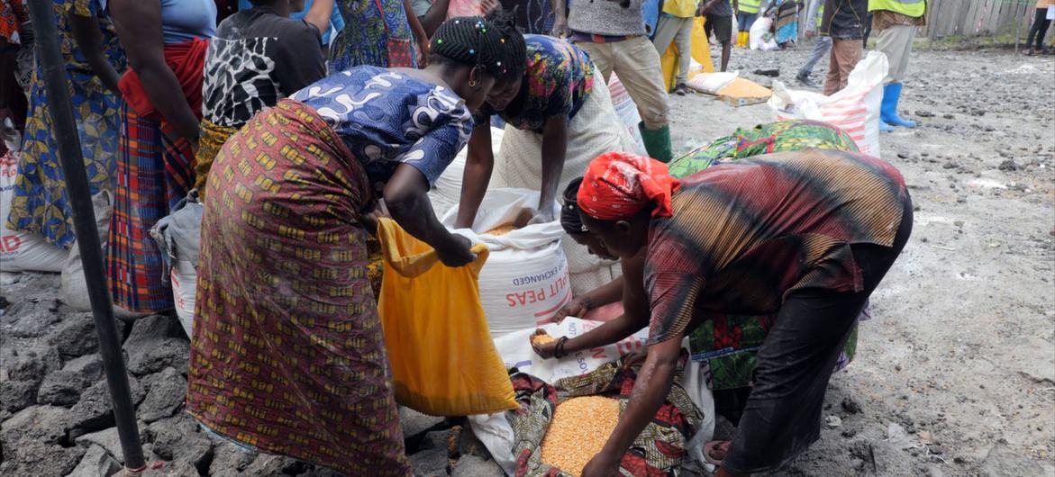 Women in Goma in the eastern DR Congo collect food provider by the UN and its partners. 