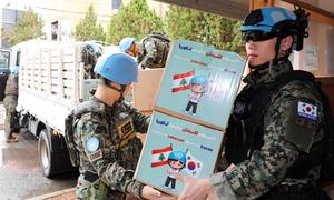 UNIFIL peacekeepers from the Republic of Korea provide assistance to people returning to their homes in southern Lebanon. 