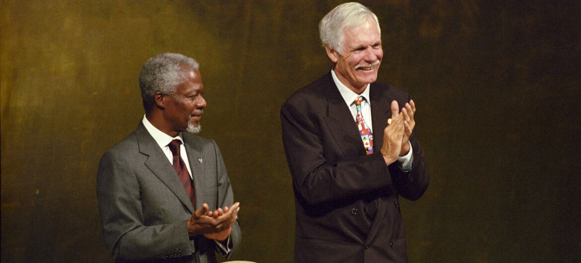 UN Secretary-General Kofi Annan and Ted Turner clapping at the opening of the Millennium World Peace Summit of Religious and Spiritual Leaders at UN Headquarters.