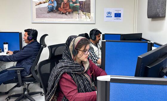 A UNHCR helpline team in Pakistan, where multilingual staff provide support to refugees and asylum seekers, including women with children and widows facing uncertainty.